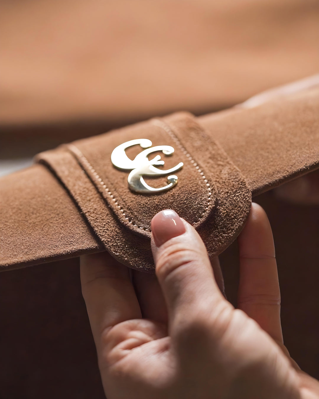 AURA cognac suede handbag