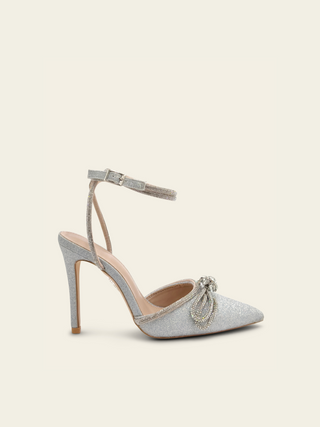 BLAIR - Glittery silver pumps with crisscross straps and double bows decorated with rhinestones 